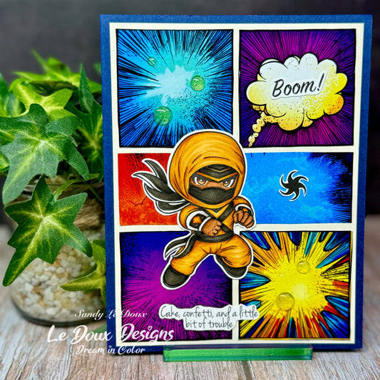 Colorful card with a ninja design and comic book elements, featuring 'Le Doux Designs' branding.