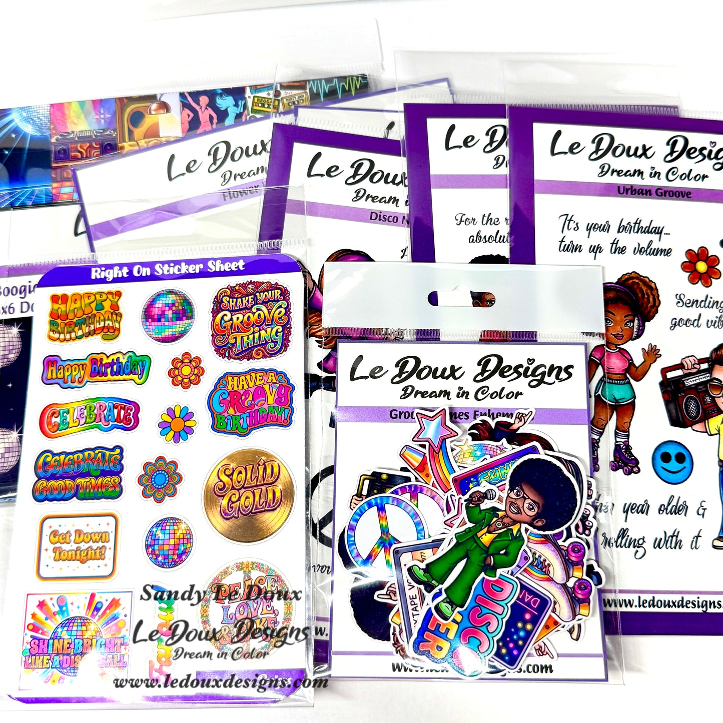 Collection of Le Doux Designs sticker sheets and packaging on a white background