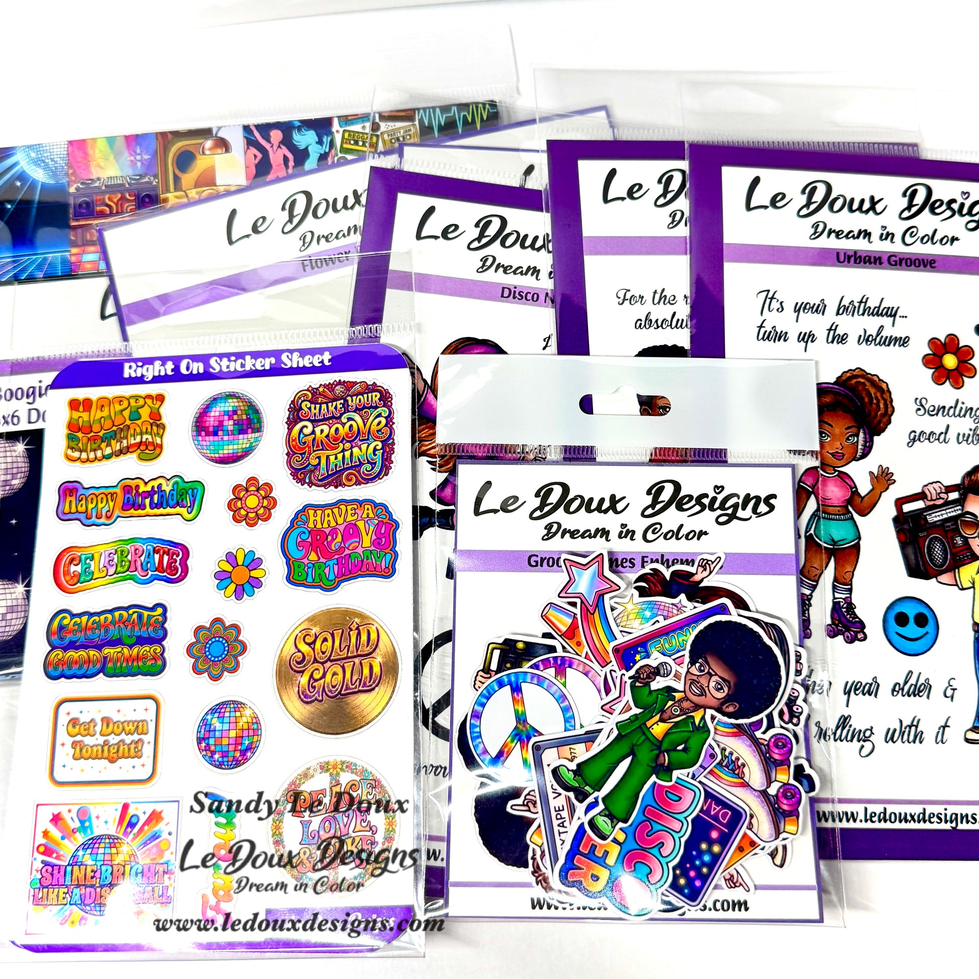 Collection of Le Doux Designs sticker sheets and packaging on a white background