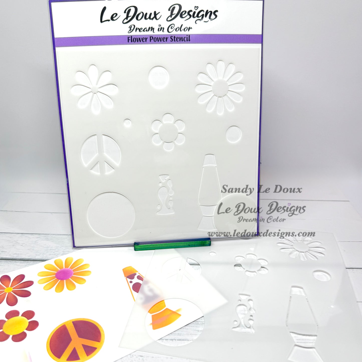 Le Doux Designs flower power stencil with colorful samples on a white background